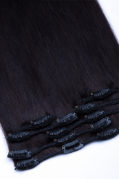 Dieses Bild zeigt die 7-teilige von GlamXtensions  zum Clip In Extension Haarverlängerung aus Remy Echthaaren mit 16 Clips in der Farbe #1b - Naturschwarz in Großansicht 
